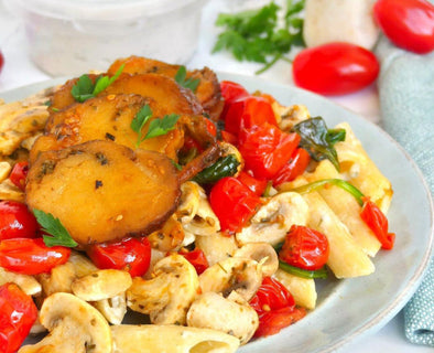 Vegan pasta with roasted seitan, creamy cheese sauce, and sautéed veggies.