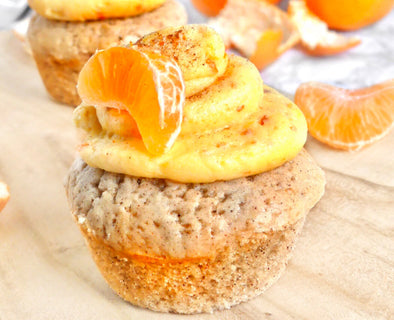 Tangy vegan cupcakes topped with fresh clementine jam buttercream icing, a delicious Italian-inspired dessert.